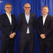 Three men in dark suits.