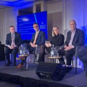 Four men and a woman during a panel discussion.