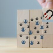 illustration of AI having a magnetic effect on customers using wooden blocks.