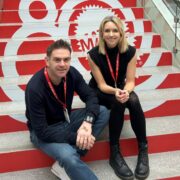 Man and woman sitting on a stairs.