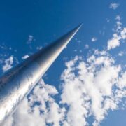 The Spire in Dublin pointing to a blue sky with clouds.