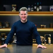 Man behind counter in coffee shop.