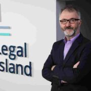 Man wearing navy blazer.