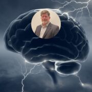 Man inset on image of a brain.