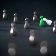 Green and white figurines among grey figurines.
