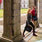 People on their way into a business event.