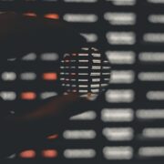 Person holding a ball of digital information.