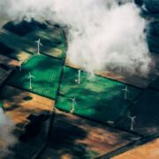aerial view of wind turbines in fields.