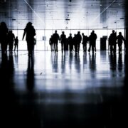 People walking up and down a corridor.
