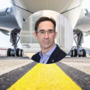 Man inset on image of aircraft on runway.