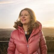 Woman in orange coat.