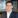 Dark-haired man in suit.