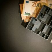 Save box with cash beneath it to denote saving for a pension.