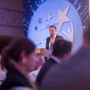 Man speaking at podium.