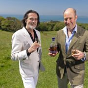 Two men drinking whiskey off the coast of Dublin.