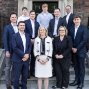 Group of people on the steps of a business in Ireland.