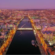 Dublin city lit up at dusk.