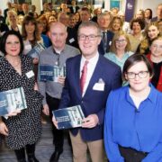 Large group of people launching a report.