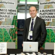 Man at a stand in an exhibition.