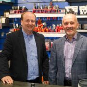 Two men in an electrical shop.