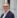 Man in suit and glasses.