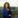 Woman wearing blue business suit.