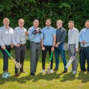 Group of people on a sports pitch.