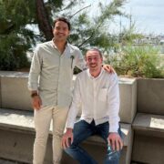 Two men beside the sea,