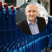 Man inset on image of shopping trolleys.