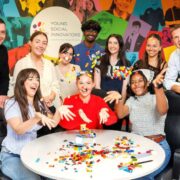 Group of young people around a table.
