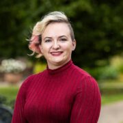 Woman in red jumper.