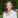 Smiling woman in business suit.