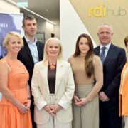 Group of men and woman launching an event on AI for finance.