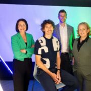 Two men and two women in a photo studio.