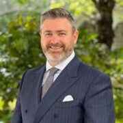 Bearded man in suit.