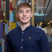 Young man in a navy shirt.