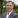 Man in grey suit.