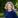 Fair-haired woman in blue jumper.