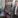 Two men standing at a forecourt.