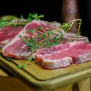 Lamb chops on a cutting board.