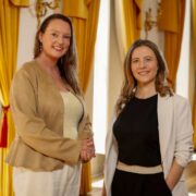 Two women in business attire.