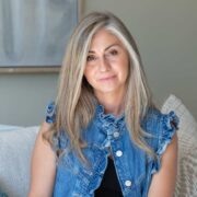 Fair-haired woman in denim shirt.