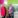 Woman in pink jacket beside man in grey jacket.