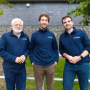 Three men in navy tops.