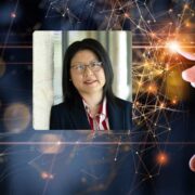 Woman inset on image of a hand touching technology.