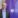 Man in suit before a purple UCD banner.