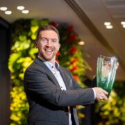 Man holding an award.