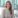 Smiling woman in an office.