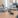 Empty podcast studio with microphones.