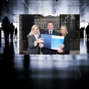 People holding a report inset on an image of people walking a corridor.